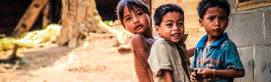 Kids in the village of Kuang Si Waterfalls park